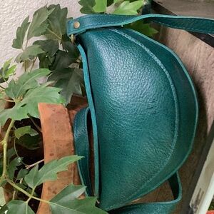 Here is a Koala crossbody leather bag in sea glass color. 6x9x3